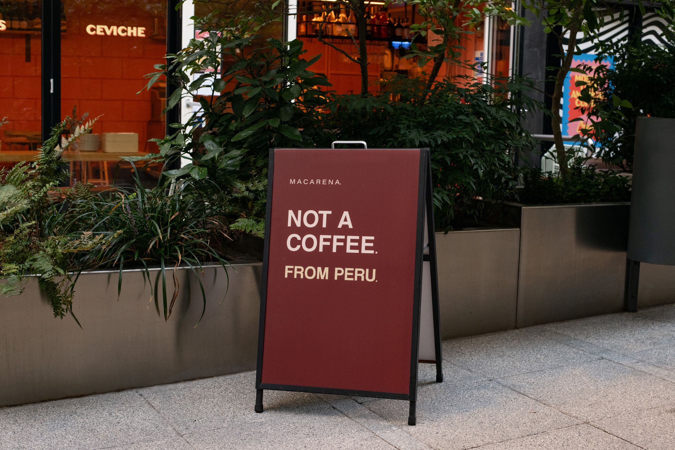 The Macarena A-board outside Crudo on Old Street